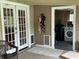 Back porch with french doors, doggie doors, and a view into the laundry room at 9510 N Cooney Rd, Mooresville, IN 46158