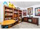 Recreation room with built-in shelving, cabinets, and ample space for storage and entertainment at 9510 N Cooney Rd, Mooresville, IN 46158
