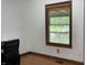 Office space with a wooden window with blinds and hardwood floor at 9510 N Cooney Rd, Mooresville, IN 46158
