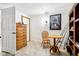 This room features a dresser, table and chair with a Godzilla poster on the wall at 9510 N Cooney Rd, Mooresville, IN 46158