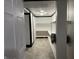 Walk-in storage room featuring ample shelving and neutral-toned flooring, illuminated by a central light fixture at 9510 N Cooney Rd, Mooresville, IN 46158