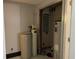 Basement area featuring a modern water conditioning system and hot water tank at 9510 N Cooney Rd, Mooresville, IN 46158