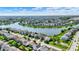 Aerial view of a scenic residential neighborhood surrounding a winding lake on a sunny day at 9557 W Lantern Ln, Pendleton, IN 46064