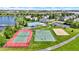 Aerial view of community amenities featuring a pool, tennis court, basketball court, and playground at 9557 W Lantern Ln, Pendleton, IN 46064