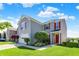 Charming two-story home featuring a well-maintained lawn, red shutters, and an attached garage at 9557 W Lantern Ln, Pendleton, IN 46064
