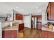 Spacious kitchen with stainless steel appliances, warm wood cabinets, and a functional layout at 9557 W Lantern Ln, Pendleton, IN 46064