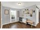 Bright living area showcasing hardwood floors, a large window, and tasteful wall decor at 9557 W Lantern Ln, Pendleton, IN 46064