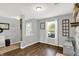 Open-concept living space with hardwood floors, natural light, and neutral wall colors at 9557 W Lantern Ln, Pendleton, IN 46064