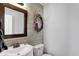 Well-lit powder room featuring modern fixtures, shiplap accents, and a decorative mirror at 9557 W Lantern Ln, Pendleton, IN 46064