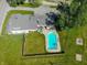 Aerial view of a home with a fenced backyard featuring a refreshing in-ground pool and well-maintained lawn at 9579 N Fortville Pike, Fortville, IN 46040