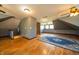 Spacious finished attic featuring hardwood floors and natural light at 9579 N Fortville Pike, Fortville, IN 46040