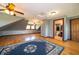Spacious finished attic featuring hardwood floors and natural light at 9579 N Fortville Pike, Fortville, IN 46040