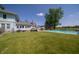 Backyard featuring a pool, large tree, grass and fence at 9579 N Fortville Pike, Fortville, IN 46040
