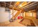 Unfinished basement featuring exposed beams, concrete floor and stairs at 9579 N Fortville Pike, Fortville, IN 46040
