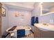 Charming bathroom featuring a clawfoot tub, patterned tile, and vanity at 9579 N Fortville Pike, Fortville, IN 46040