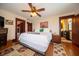 Bedroom featuring hardwood floors, natural light, and an ensuite bathroom at 9579 N Fortville Pike, Fortville, IN 46040