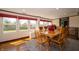 Bright dining room featuring large windows, and a large dining table with seating for six at 9579 N Fortville Pike, Fortville, IN 46040