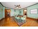 Traditional dining room with hardwood floors, green walls, and wooden table with seating for six at 9579 N Fortville Pike, Fortville, IN 46040