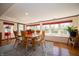 Bright dining room featuring large windows, and a large dining table with seating for eight at 9579 N Fortville Pike, Fortville, IN 46040