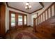 Inviting foyer featuring hardwood floors, staircase, and natural light at 9579 N Fortville Pike, Fortville, IN 46040