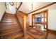 Spacious foyer with hardwood floors, grand staircase, and open doorway to living room at 9579 N Fortville Pike, Fortville, IN 46040