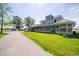 Two-story home with wrap-around porch, spacious lawn, and detached garage at 9579 N Fortville Pike, Fortville, IN 46040