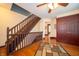 Second story hallway with hardwood flooring and staircase to the first story at 9579 N Fortville Pike, Fortville, IN 46040