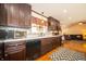 Well-lit kitchen features granite counters, dark cabinetry, and stainless steel appliances at 9579 N Fortville Pike, Fortville, IN 46040