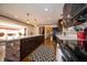 Well-lit kitchen features island with breakfast bar, stainless appliances, and dark cabinetry at 9579 N Fortville Pike, Fortville, IN 46040