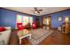 Comfortable living room with hardwood floors, oriental rug, and wood trim at 9579 N Fortville Pike, Fortville, IN 46040