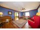 Cozy living room featuring hardwood floors, a decorative rug, and comfortable seating at 9579 N Fortville Pike, Fortville, IN 46040