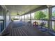 Inviting covered porch with comfortable seating and wooden flooring at 9579 N Fortville Pike, Fortville, IN 46040