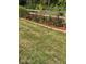 Backyard featuring a fence lined with blooming roses with wood-chip mulch at 9909 E Mcgregor Rd, Indianapolis, IN 46259