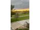 A beautiful fenced backyard with an ornamental metal garden arch at 9909 E Mcgregor Rd, Indianapolis, IN 46259
