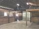 Barn interior featuring horse stalls and ample space, perfect for equestrian enthusiasts at 9909 E Mcgregor Rd, Indianapolis, IN 46259