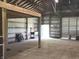 A spacious barn interior featuring high ceilings and a large open area, ideal for storage or workshop space at 9909 E Mcgregor Rd, Indianapolis, IN 46259