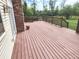 Spacious wooden deck perfect for outdoor entertaining, overlooking the lush backyard at 9909 E Mcgregor Rd, Indianapolis, IN 46259