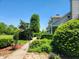 Charming home with a beautifully landscaped front yard and a pathway leading to the entrance at 9909 E Mcgregor Rd, Indianapolis, IN 46259