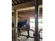 An indoor horse stall with two horses, showcasing rustic wood beams and providing a safe, comfortable environment at 9909 E Mcgregor Rd, Indianapolis, IN 46259