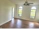 Living room with hardwood floors and windows at 9909 E Mcgregor Rd, Indianapolis, IN 46259