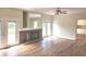 Living room with hardwood floors, fireplace and double doors at 9909 E Mcgregor Rd, Indianapolis, IN 46259