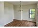 Living room with hardwood floors and a chandelier at 9909 E Mcgregor Rd, Indianapolis, IN 46259