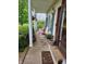 Inviting front porch with rocking chairs and green plants at 9909 E Mcgregor Rd, Indianapolis, IN 46259