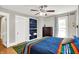 Bright bedroom with hardwood floors, a large bed, and built-in shelving at 1000 E King St, Franklin, IN 46131