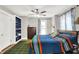 Bedroom features hardwood floors, large bed, built-in shelves and natural light at 1000 E King St, Franklin, IN 46131