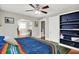 The main bedroom features hardwood floors, a large bed, and built-in shelving at 1000 E King St, Franklin, IN 46131