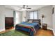 Bedroom with a ceiling fan, hardwood floors, a bed, and window with curtains at 1000 E King St, Franklin, IN 46131