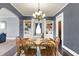 Open dining room featuring hardwood floors, and an arched view into the living room at 1000 E King St, Franklin, IN 46131