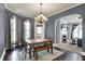 Stylish dining room featuring hardwood floors, a chandelier, and direct access to living area at 1000 E King St, Franklin, IN 46131