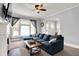 Comfortable living room featuring a large sectional sofa, fireplace, and arched doorways, perfect for relaxation at 1000 E King St, Franklin, IN 46131
